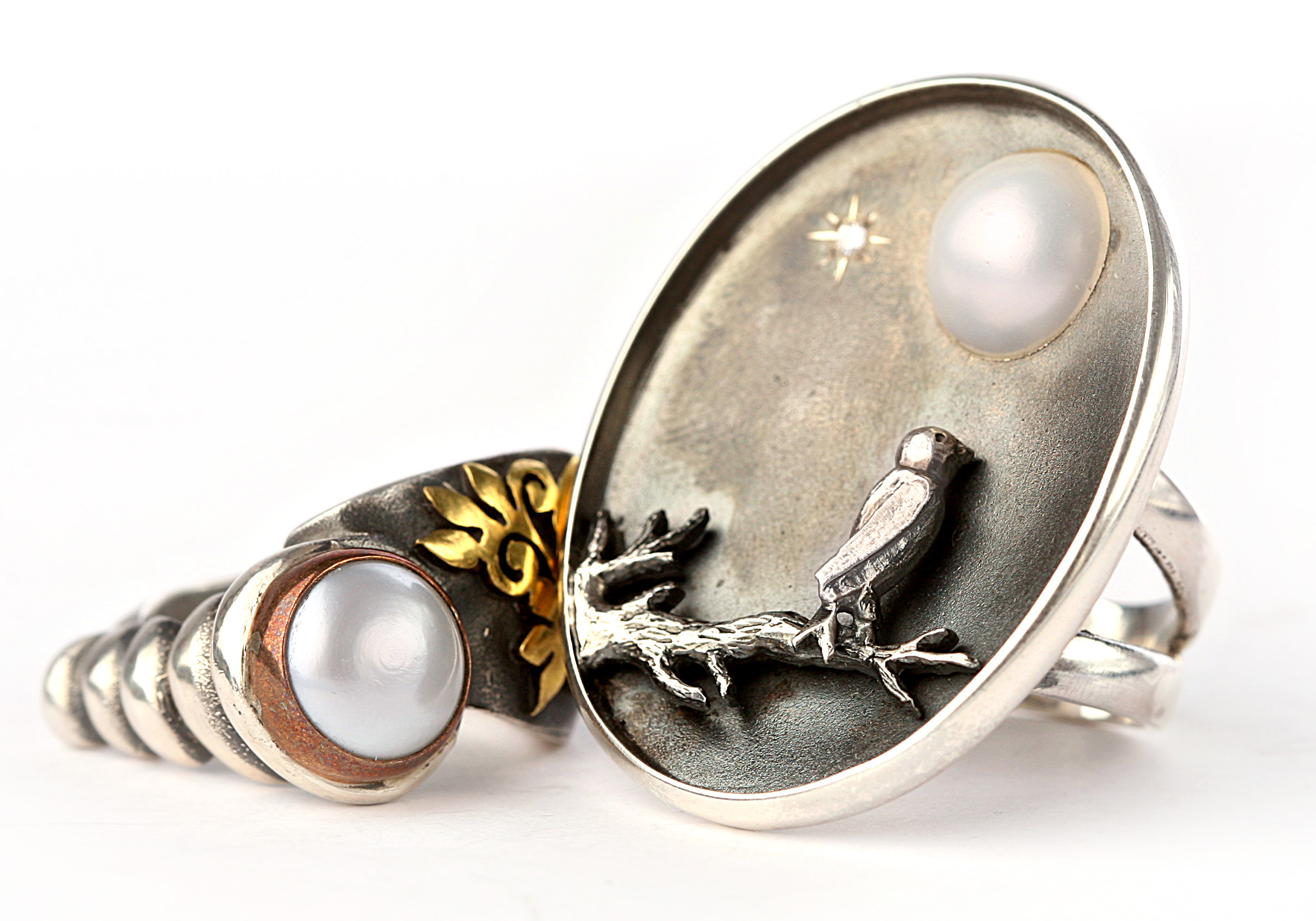 Silver rings with pearl and bird motif