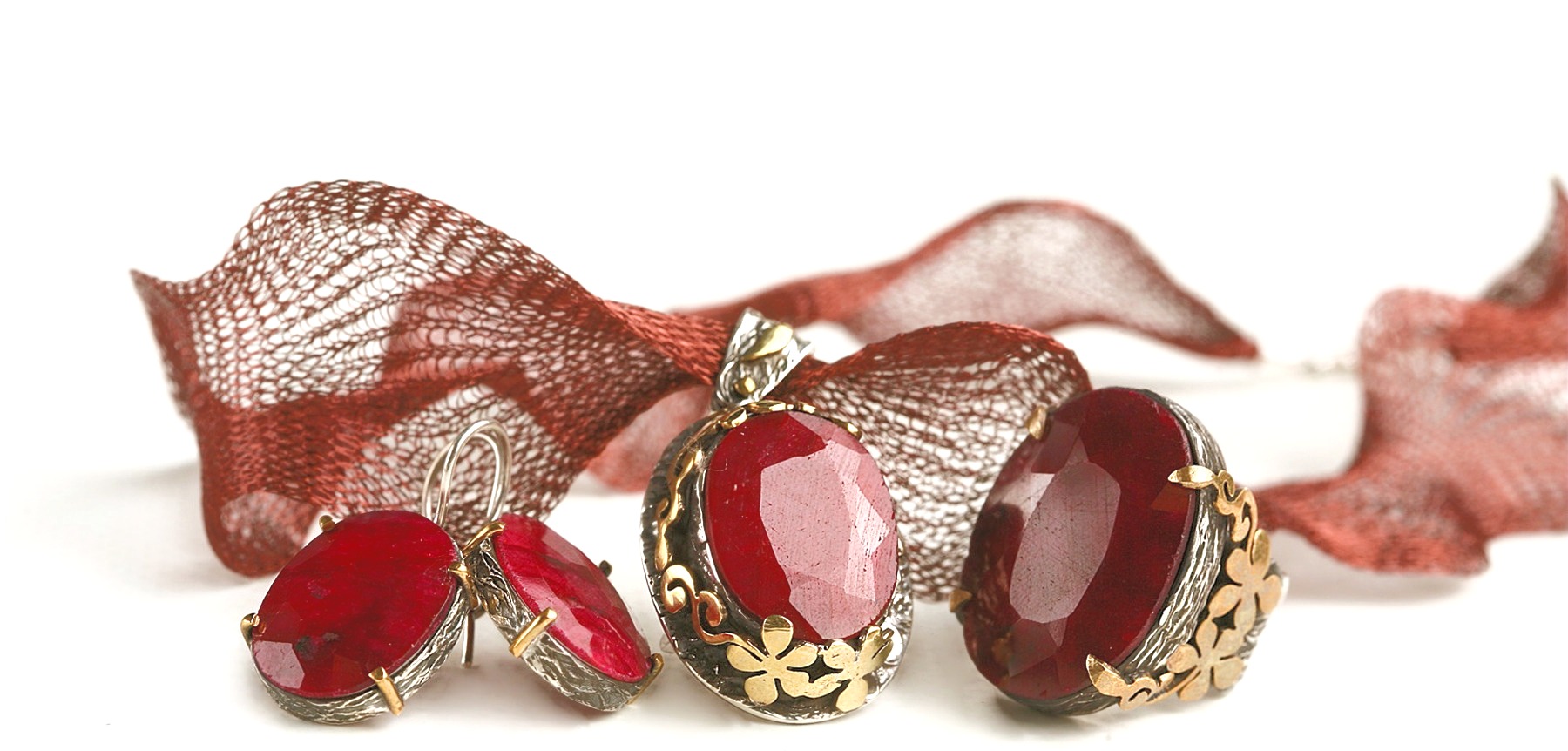 Ruby gemstone jewelry set with gold floral details